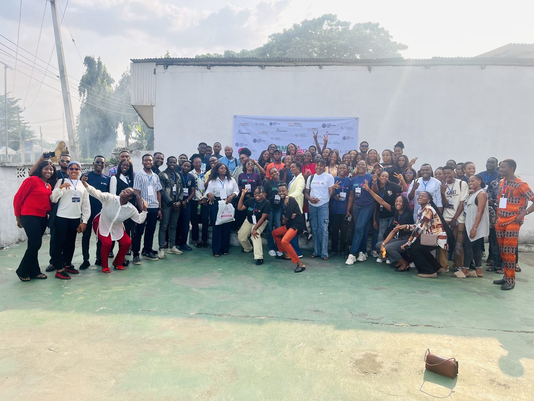 A large group of Ibom Data Community members posing together outdoors at the Ibom Data Connect conference in Uyo