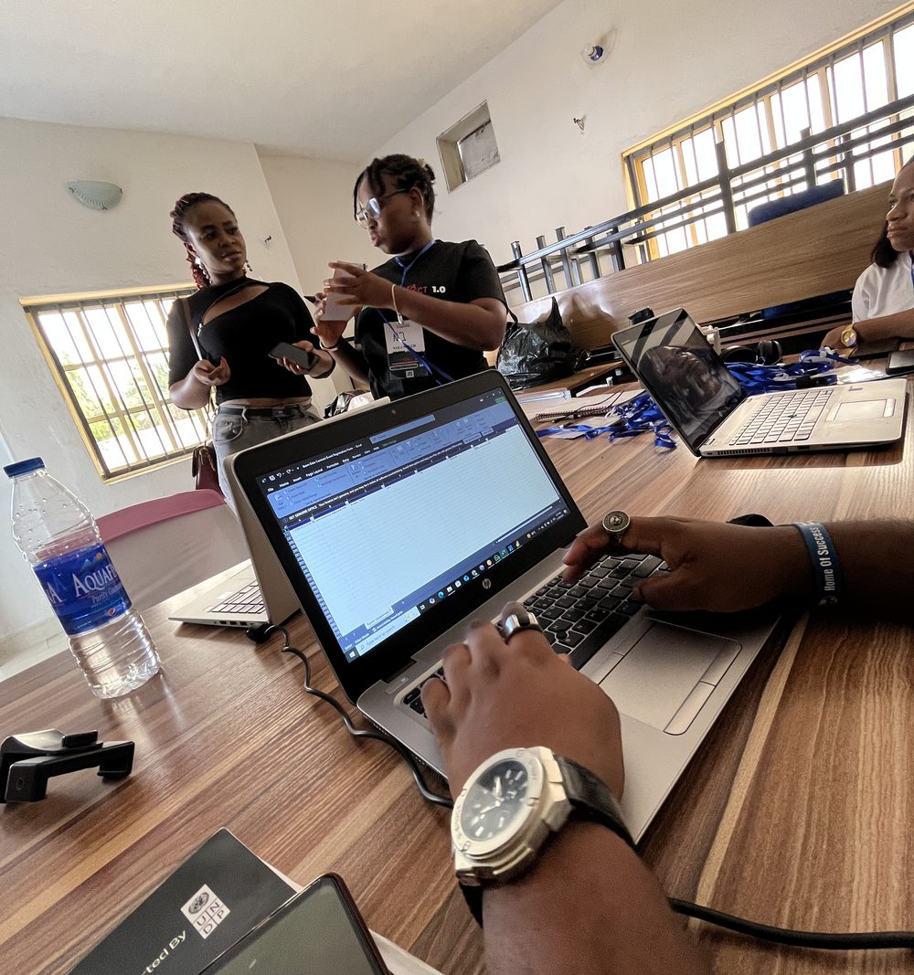 Community members collaborating on laptops during a hands-on workshop session