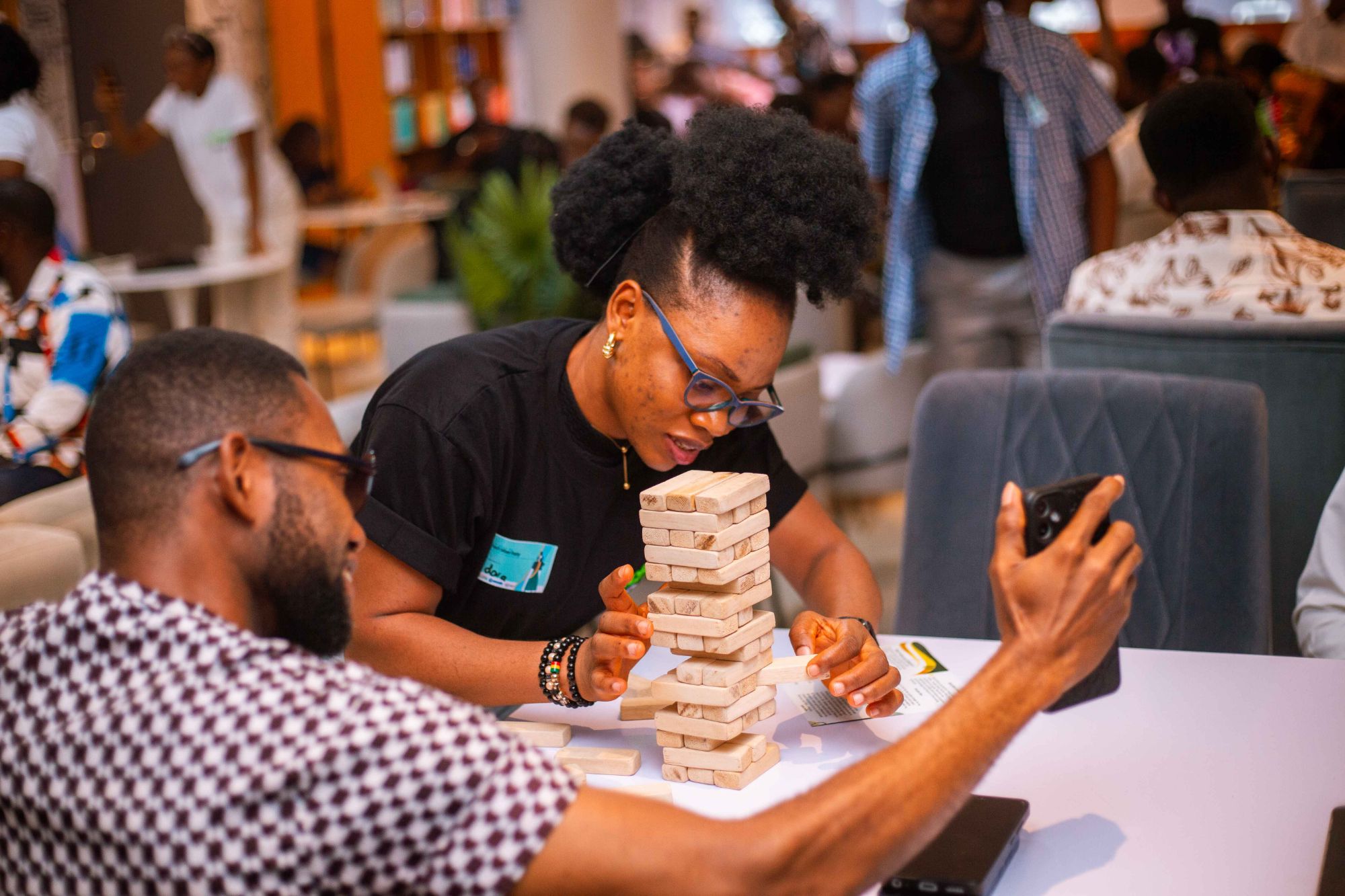 Tech Mixer Party attendees playing Jenga